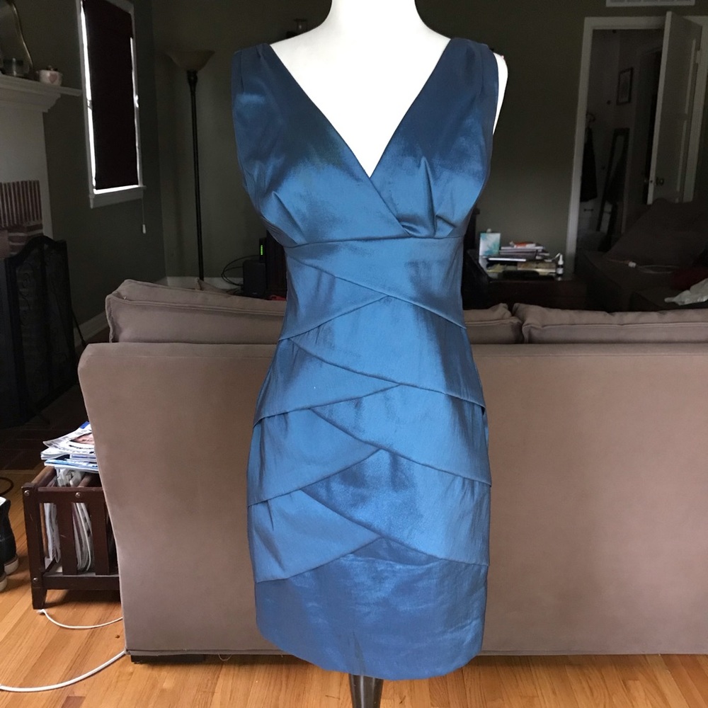 Teal colored formal cocktail dress.